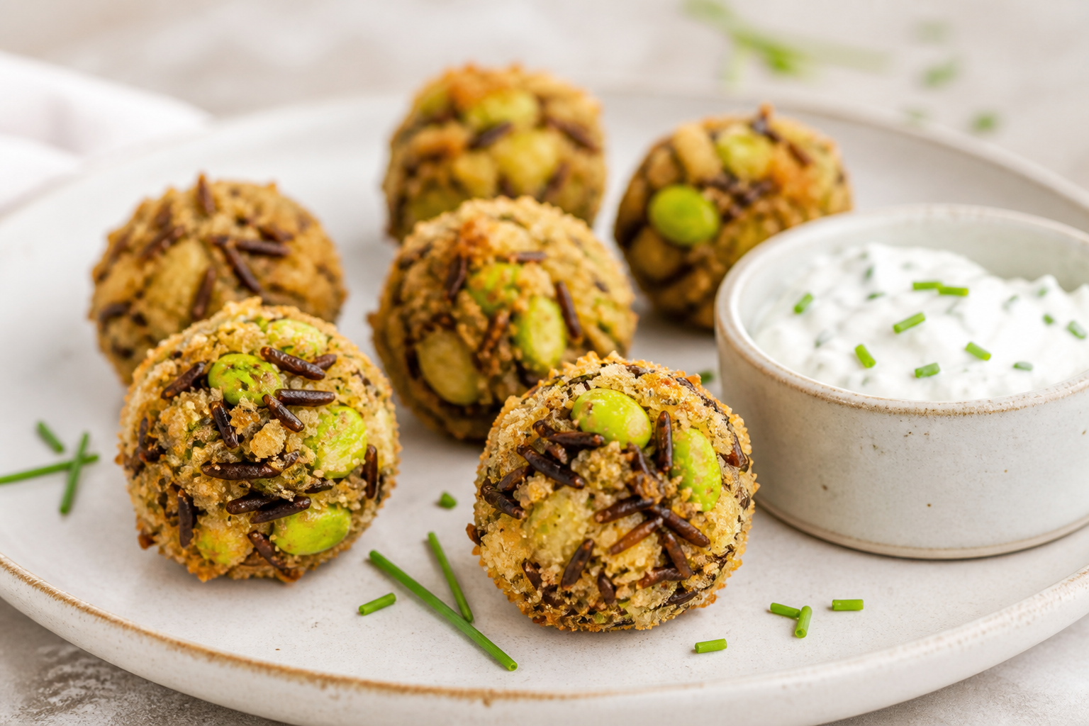 Crispy wild rice, edamame and fontina bites with lemon chive yogurt dip