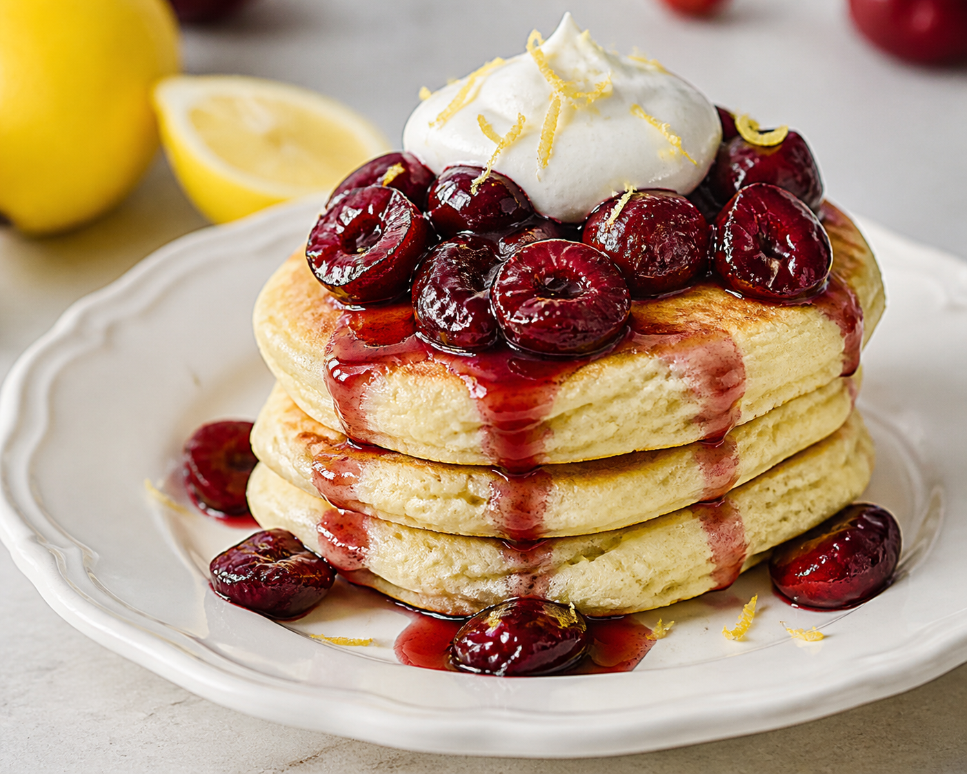 Lemon Oat Cloud Pancakes with Sautéed Cherries and Light Vanilla Cream