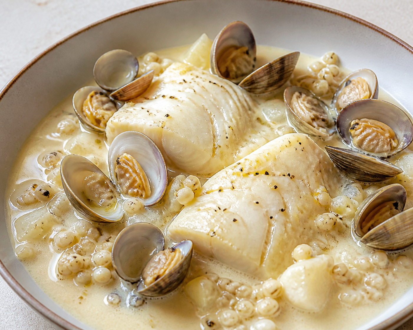 Cod and Clam Skillet with Light Celeriac Cream, Cider, and Pearl Barley
