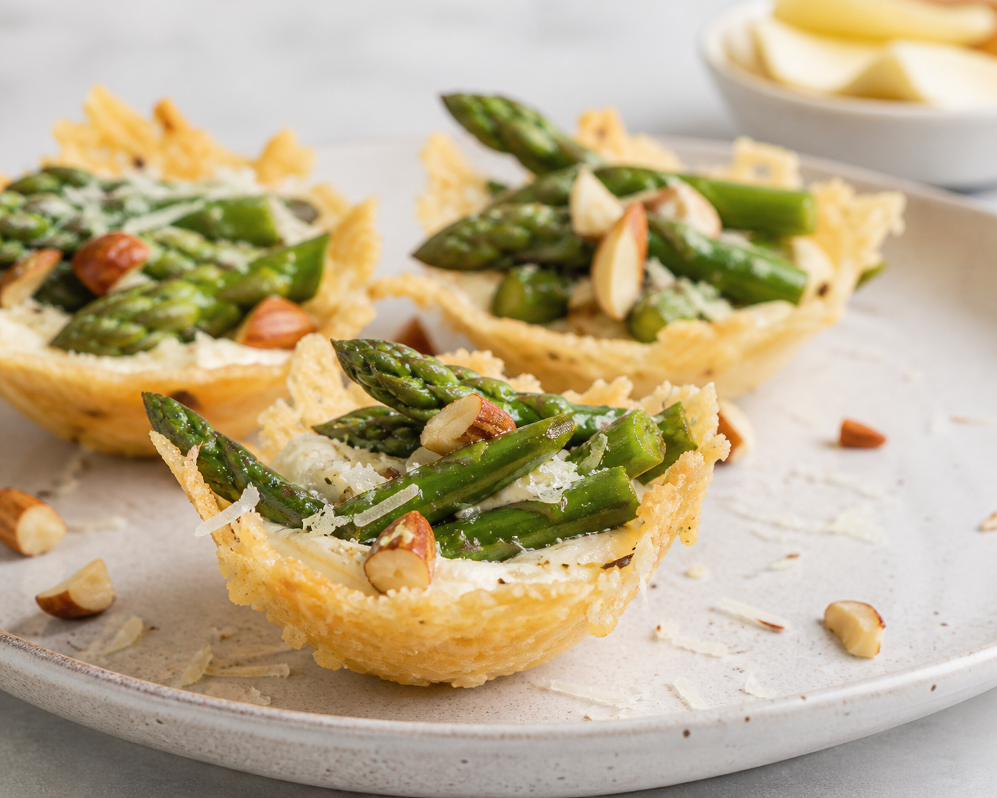 Parmesan Tartlets with Lemon Artichoke Cream, Sautéed Asparagus and Crunchy Almond