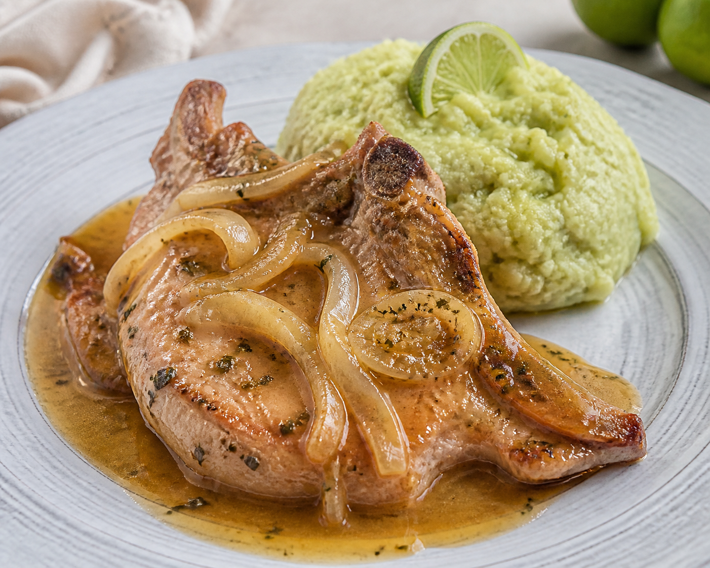 Dominican Smothered Pork Chops with Onion, Thyme and Coconut Sauce with Green Yuca Mash