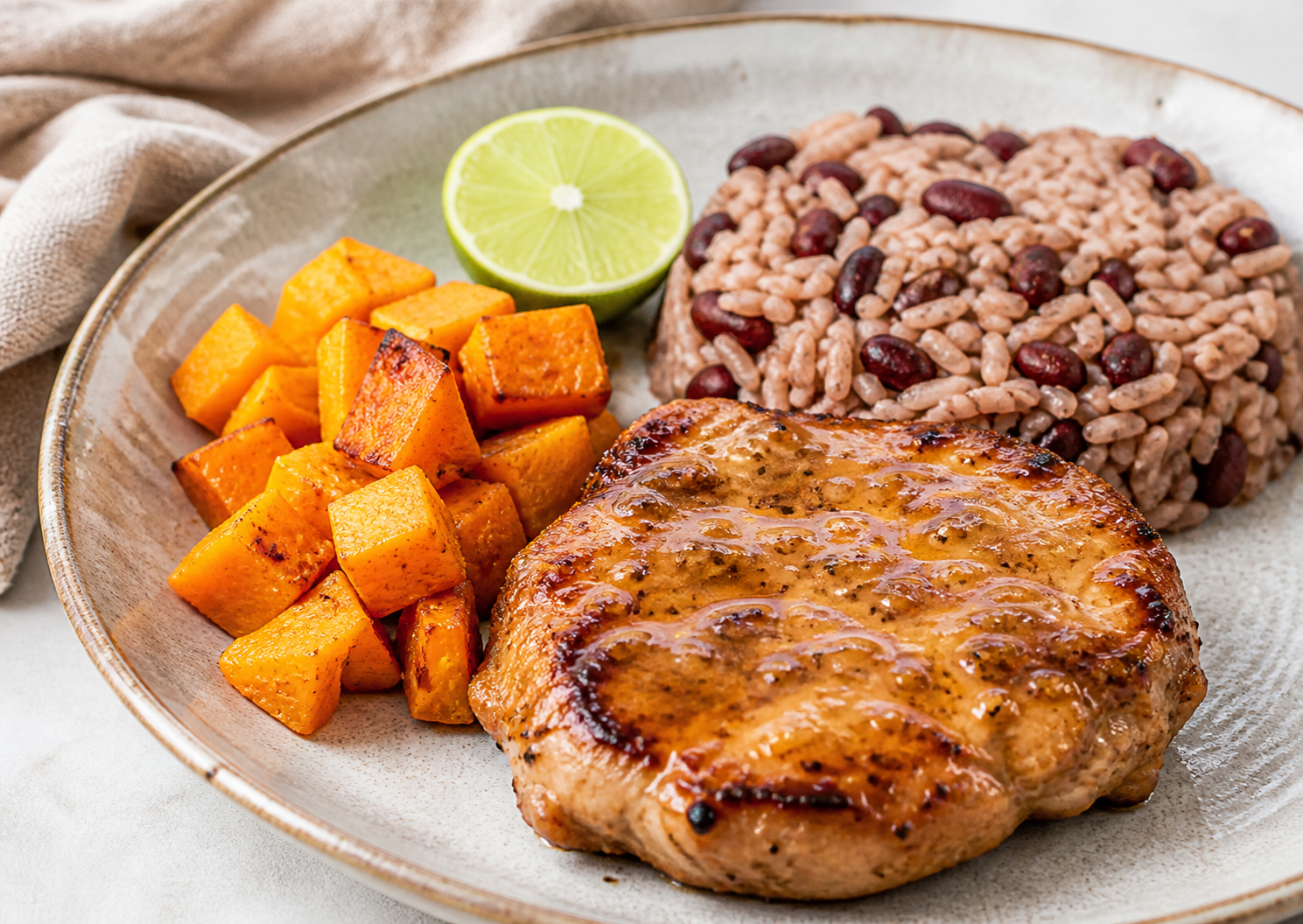 Chuletas de Cerdo Cubanas en Mojo de Guayaba y Lima con Arroz de Frijoles Colorados y Calabaza Asada