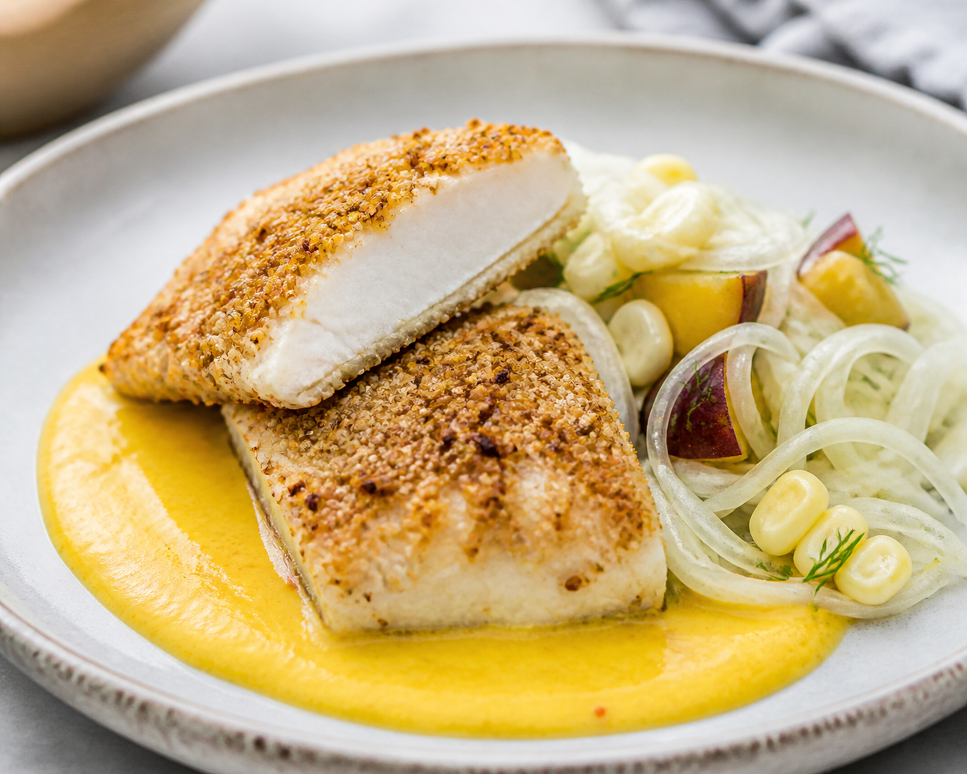 Kañihua-Crusted Fish with Warm Ají Amarillo Sauce and Potato, Corn, and Fennel Salad