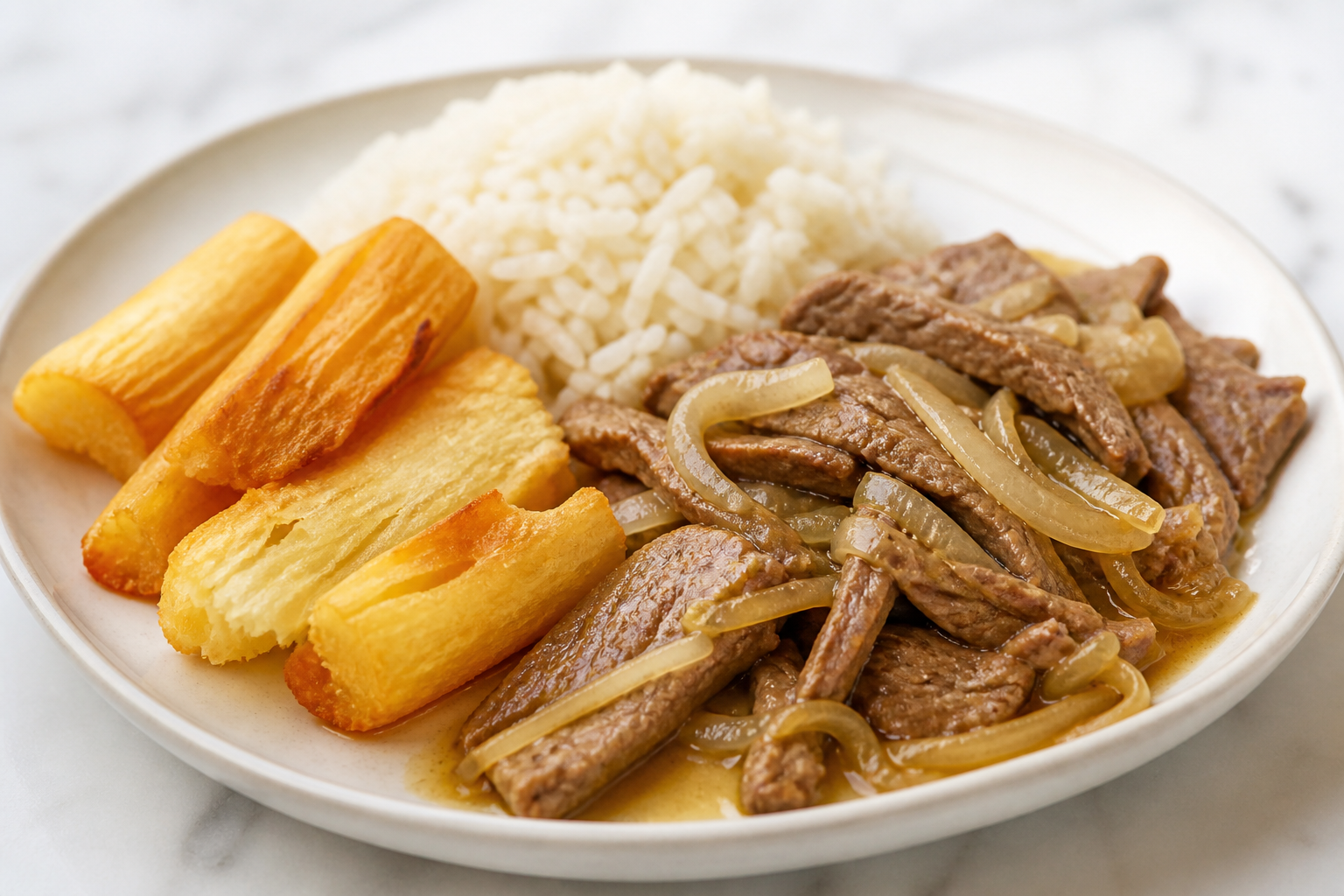 Tasajo de Res Cubano en Mojo de Cebolla y Comino con Arroz Blanco y Yuca Asada