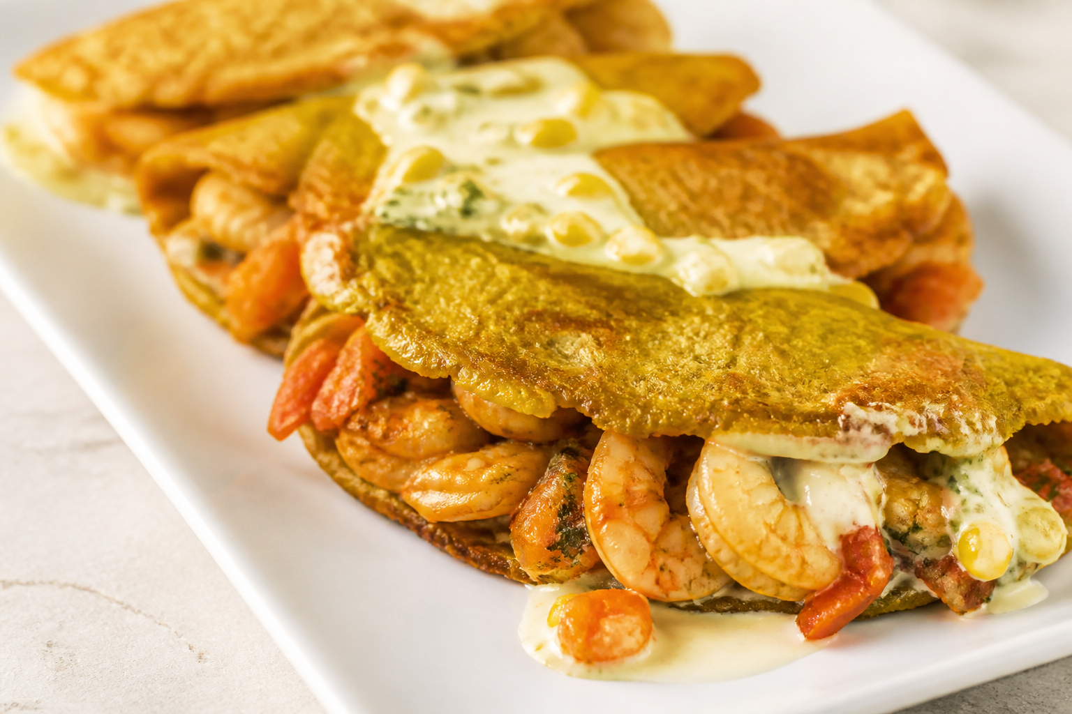 Green Plantain Turnovers Stuffed with Sofrito Shrimp and Light Corn-Lime Cream