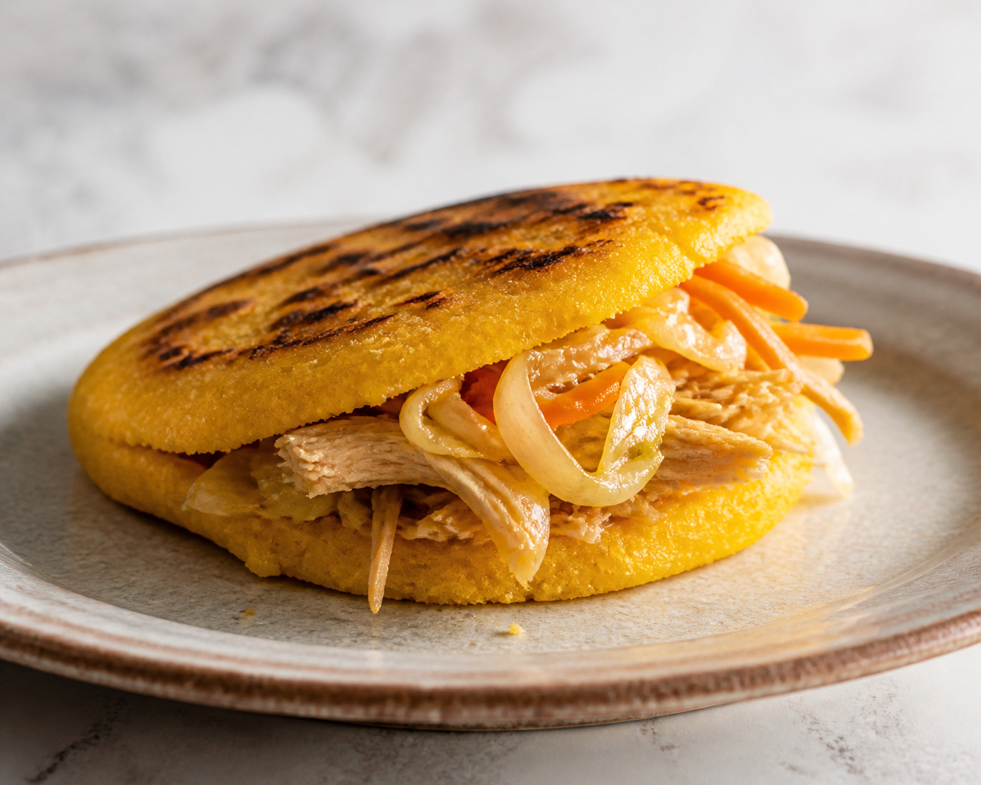 Baked Sweet Corn and Pumpkin Arepa with Gently Panela-Braised Shredded Chicken and Warm Cabbage Slaw