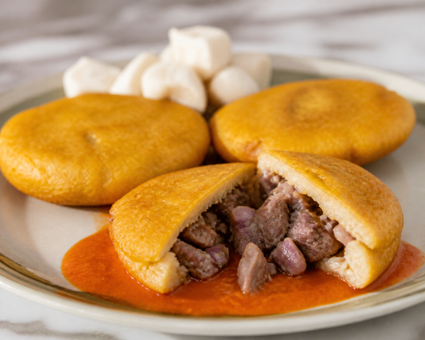 Dominican Yautía Hand Pies with Oregano Goat and Warm Tomato-Sweet Pepper Sauce