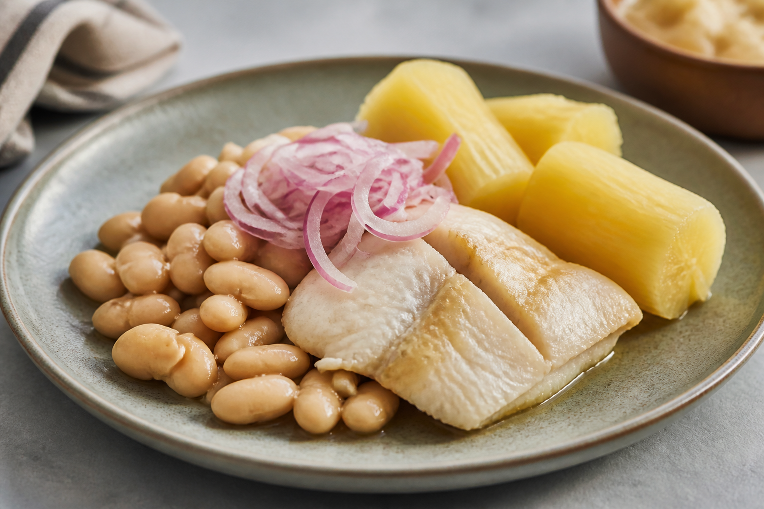 Coastal Peruvian Fish Seco with Creamy Canary Beans and Golden Yuca