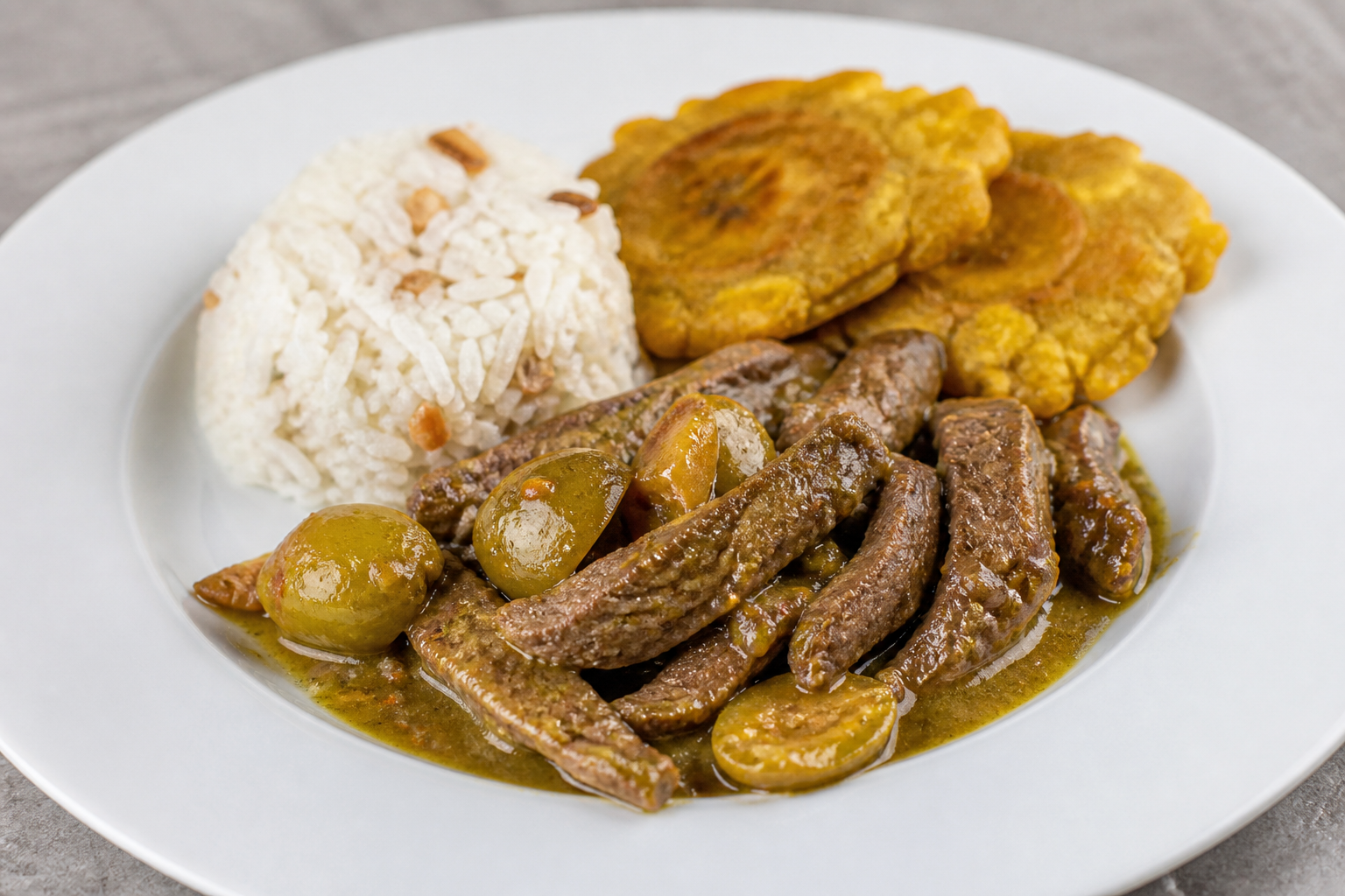 Honduran Beef in Jocote Corona Sauce with Coconut Rice and Green Plantain Patties