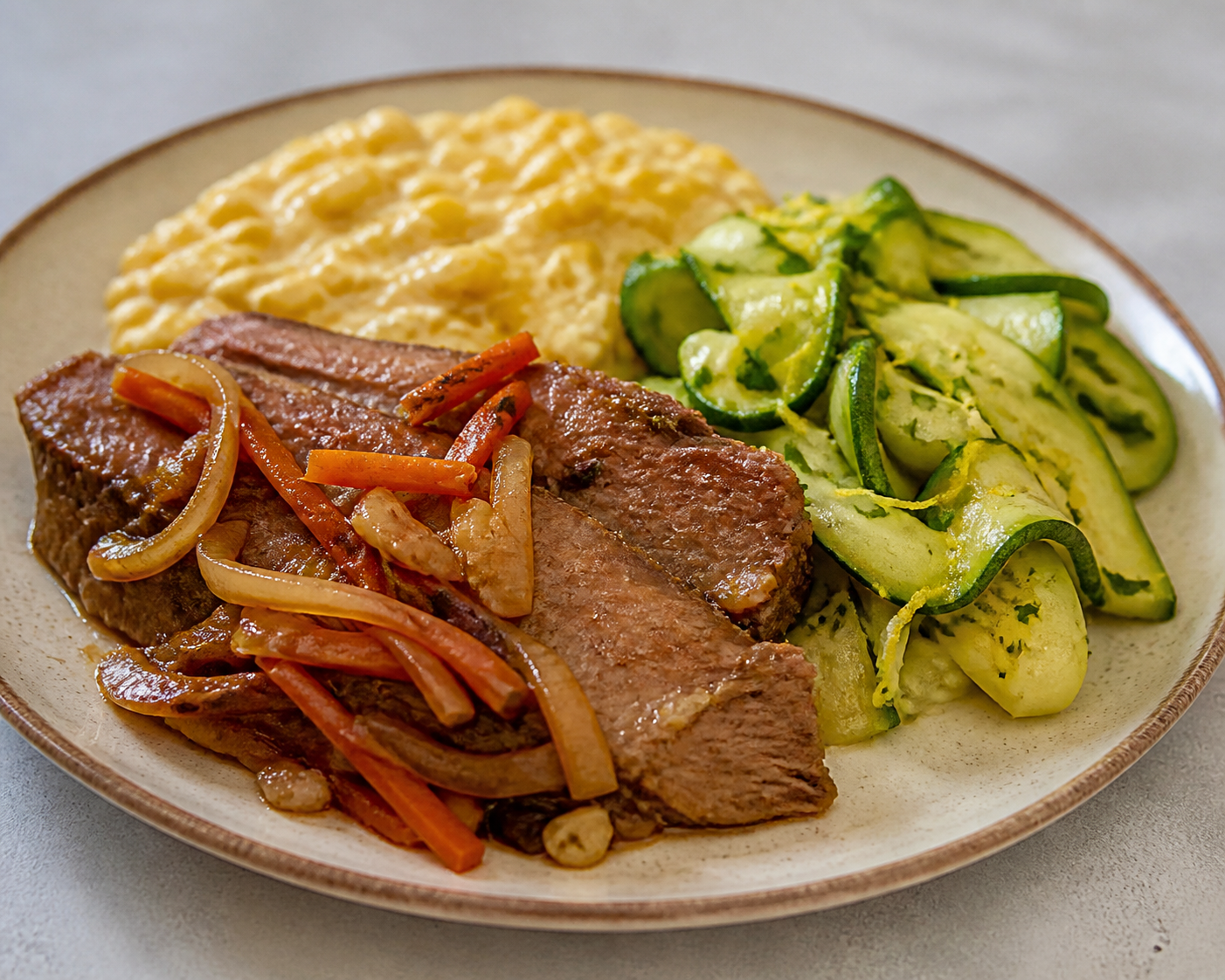Tender Braised Flank Matambre with Creamy Corn and Warm Zucchini Lemon Salad
