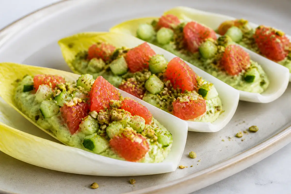 Express Endive Boats with Avocado Cream, Grapefruit, Cucumber, and Pistachio Dukkah