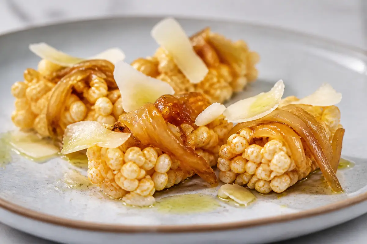 Crispy Puffed Rice Bites with Aged Cheese and Caramelized Onion